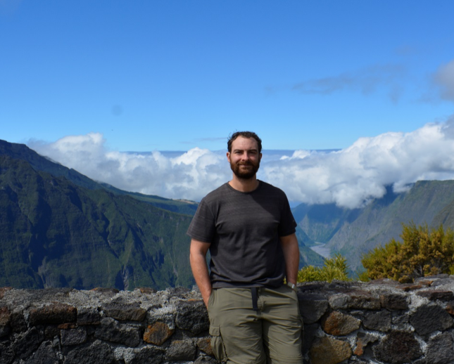 Image of James Hererra, DLC-SAVA Program Coordinator, standing on a mountain in Madagascar