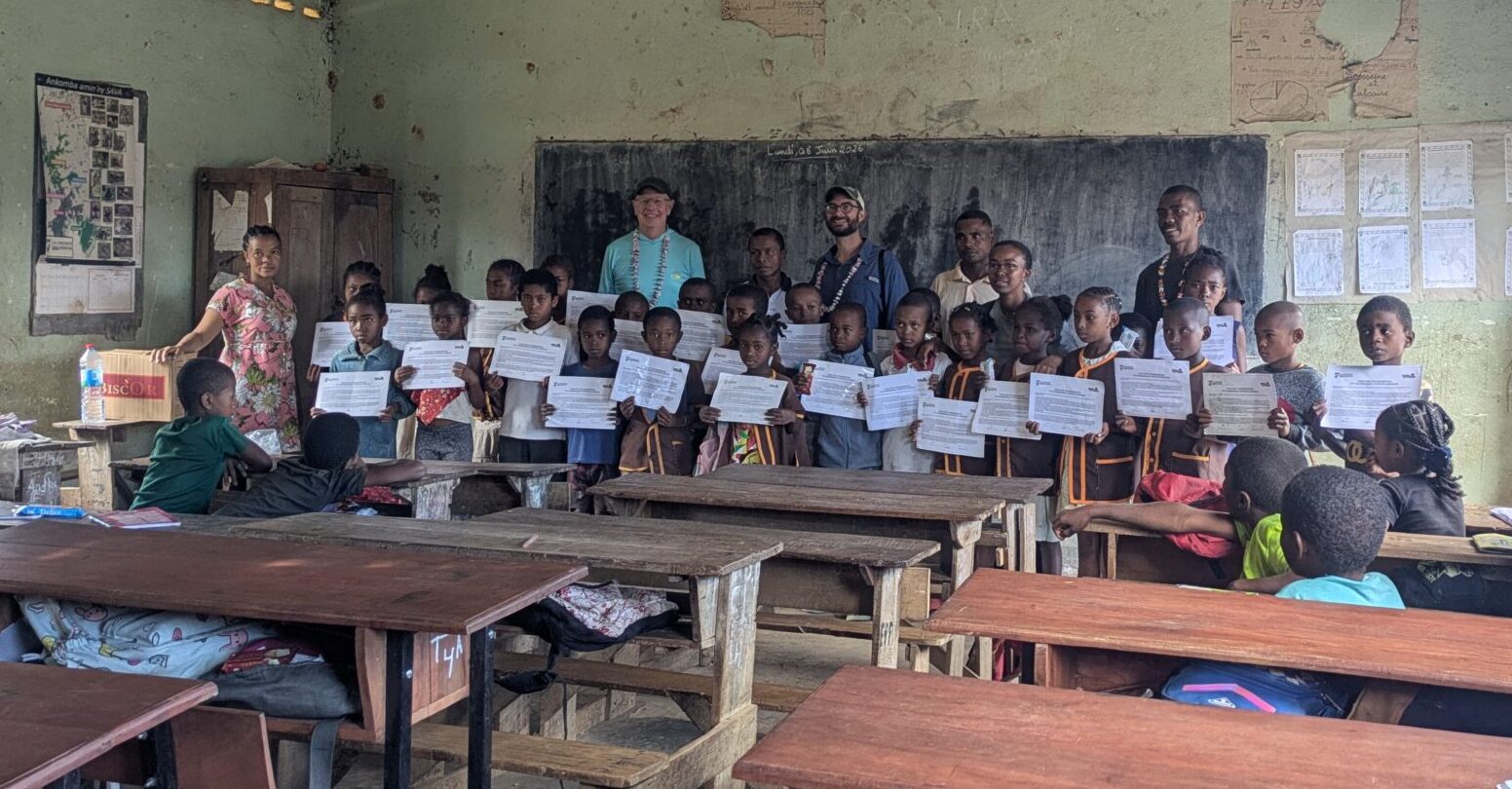 Greg Dye DLC Director with school children in Madagascar, Duke Lemur Center Environmental Education Programs